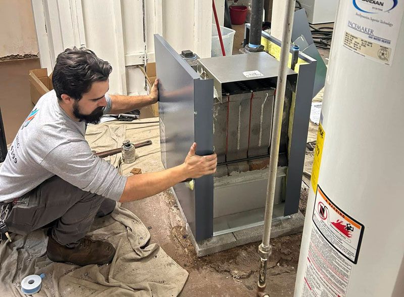L&A technician servicing heating equipment